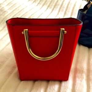Red purse with gold embellishments